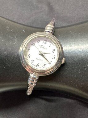 Elegant Eikon Quartz Bangle Watch With Stainless Steel Twist Band Silver Tone De